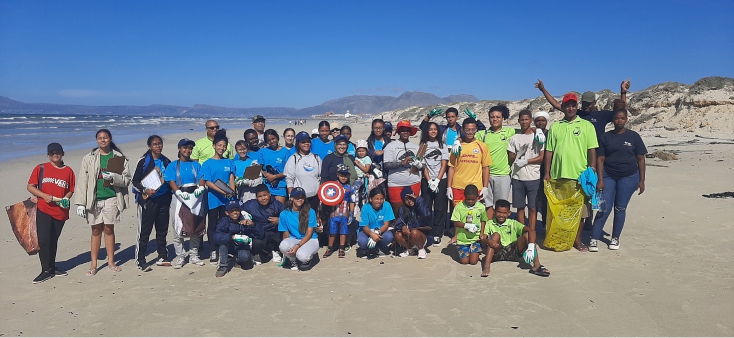 Our Ocean Ambassador, Dr Koebraa Peters, hosting a beach clean up at Blue Waters beach with the Strandfontein community. Image by SOSF Shark Education Centre.