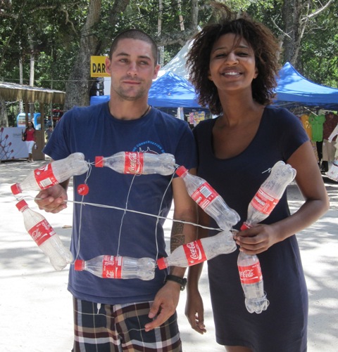 MCSS volunteer Darren with Aisatta and their fish bottle creation