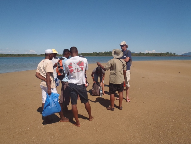 Discussing the community run sea cucumber reserve at low tide on Nosy Faly